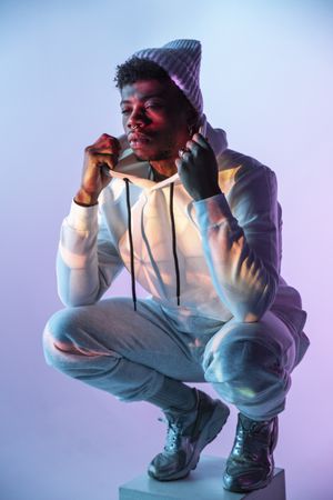 Stylish Black man on cube