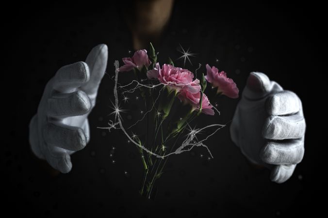Hands of unrecognizable woman with a bouquet of carnations