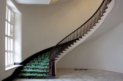 Elegant curved staircase with green carpet in Montgomery Capitol building z0gm84