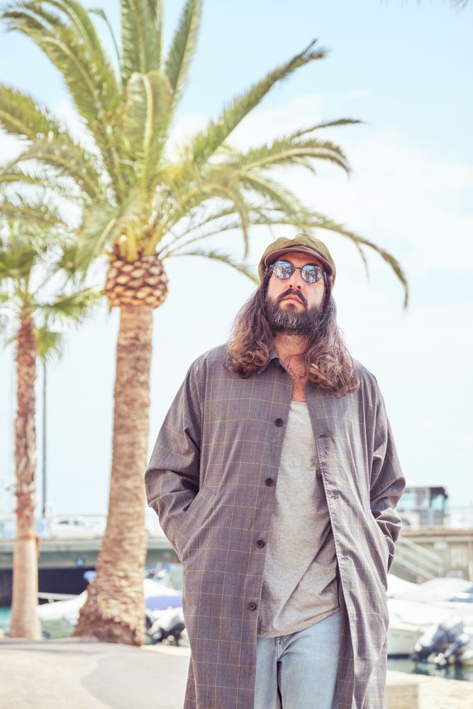 Trendy man walking in port