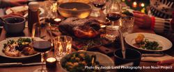 Beautiful table set up for Christmas dinner with turkey and wine 5lW7e0