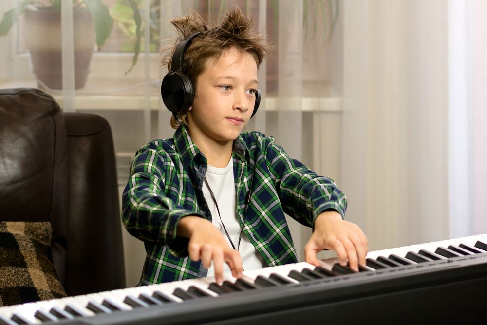 Focused Youth at Keyboard