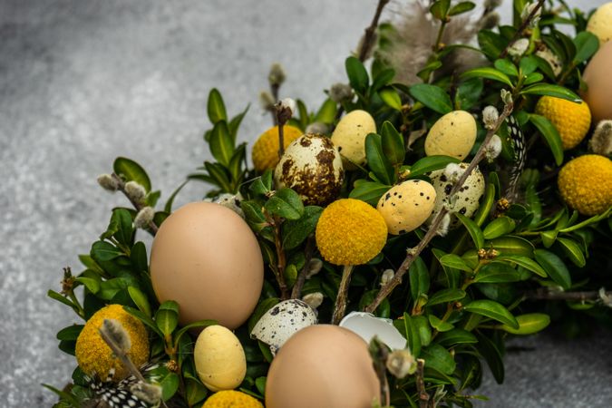 Easter card concept with wreath with eggs and branches