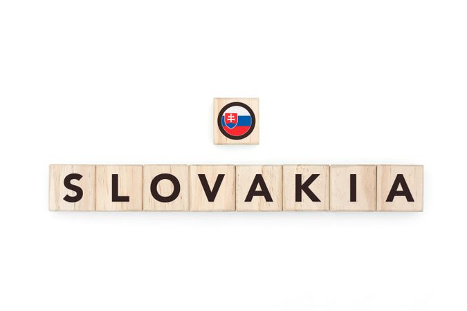 Wooden blocks bearing the name and flag of Slovakia. Slovak and East European Culture, national identity, travel, and geography in a copy space design.