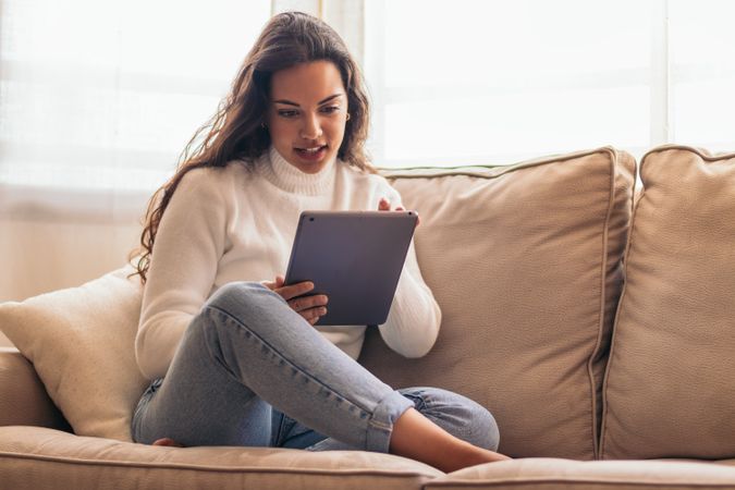 Connected Youth: A Young Woman Using a Tablet at Home