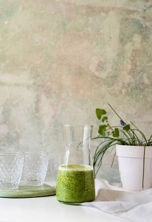 Organic Green smoothie detox drink in a glass bottle