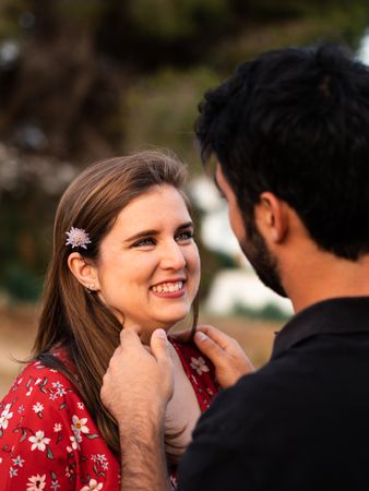 Young happy couple embracing in beautiful garden