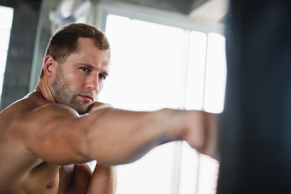 Muscular man training in gym