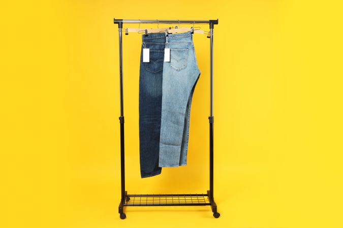 Jeans hang on hangers