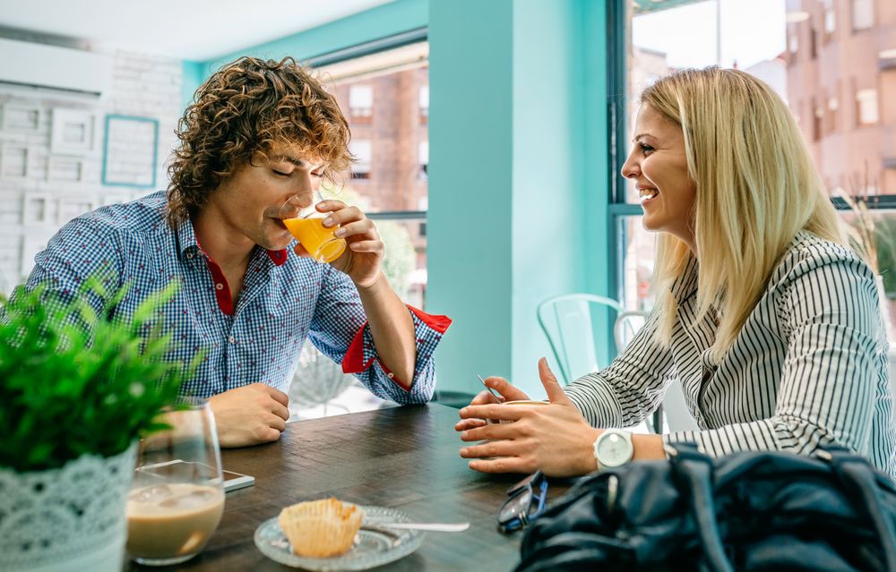 Couple eating breakfast at a cafe