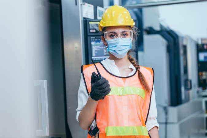 Portrait of female manager industrial engineer in PPE gear