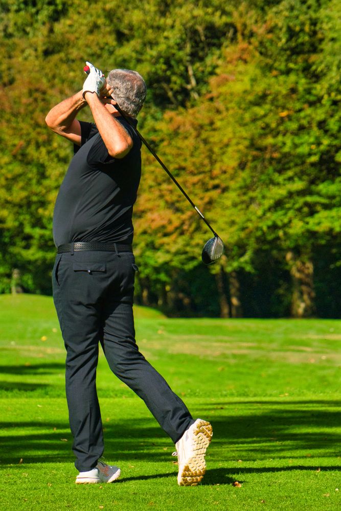 Man playing golf on field