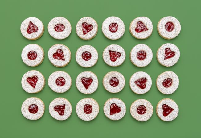 Linzer Christmas cookies top view on a green background