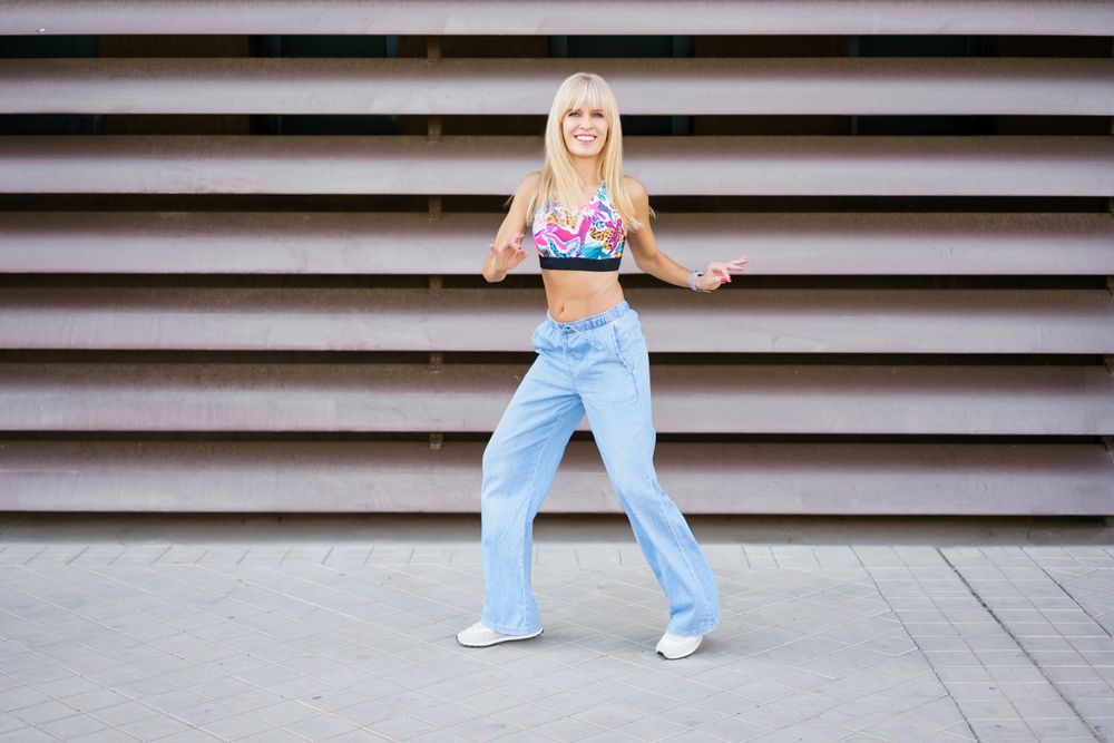 Blonde female dancer performing in the street