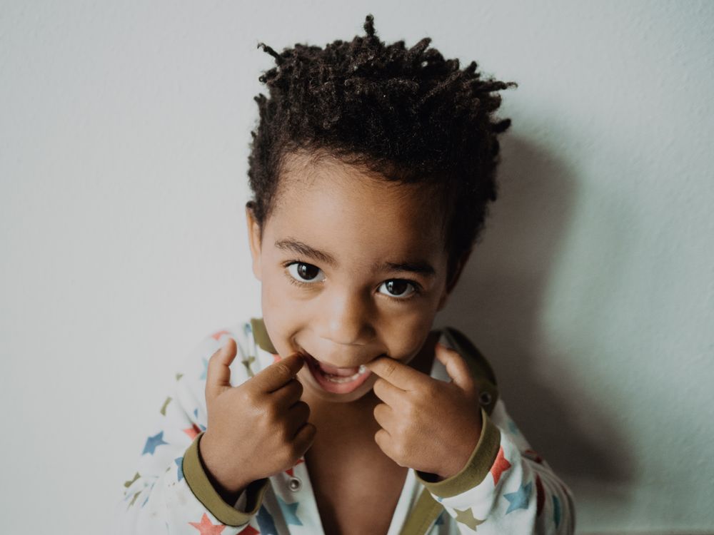 Black child grimacing for camera