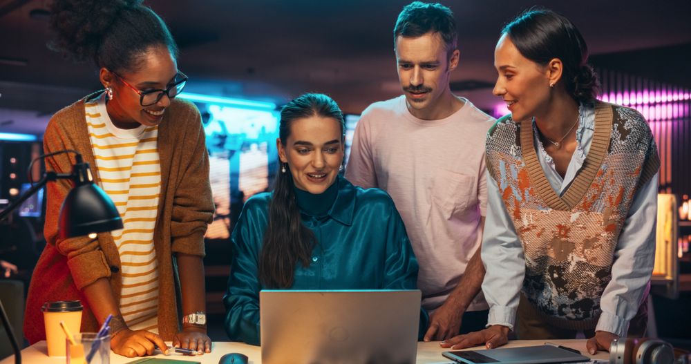 Multiethnic Group of People Working on Developing Growth Ideas Based on Data Using Laptop Computer.