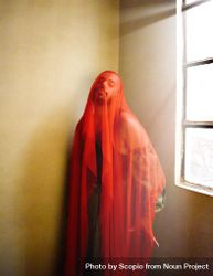 Man wearing red textile standing indoor 48987b