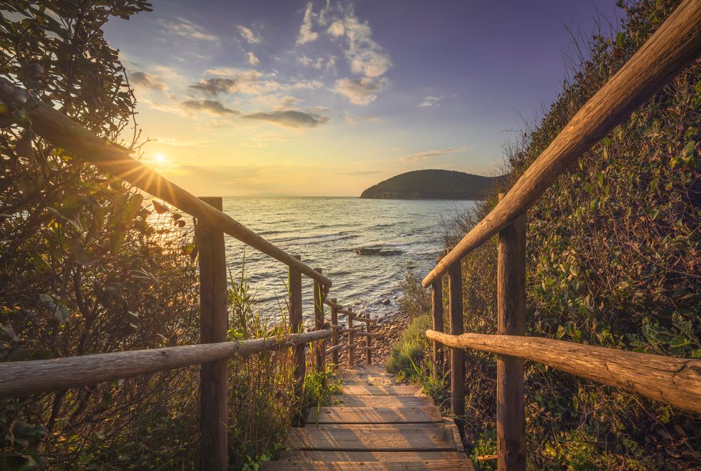 Descent to the sea in Cala Violina bay beach in Maremma, Tuscany, Italy.
