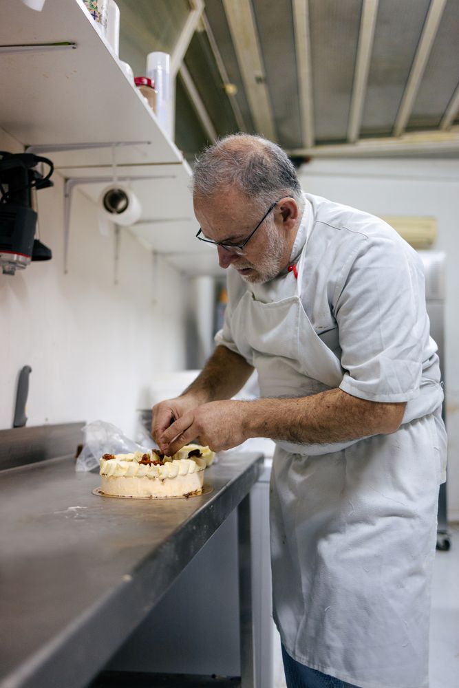 Pastry chef decorating a cake