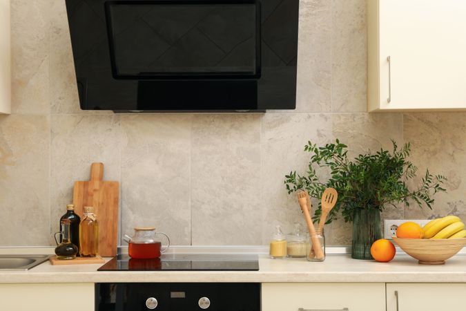 Modern kitchen interior with different supplies in light colors