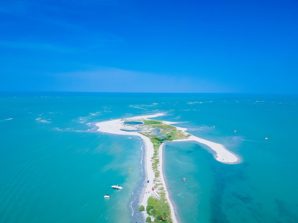 Sand path leading out to the water in Brazil