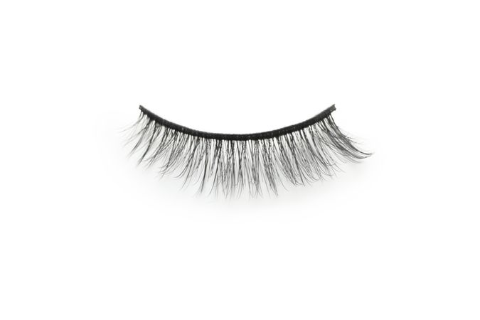 Concept of cosmetology tools, false eyelashes, isolated on light background