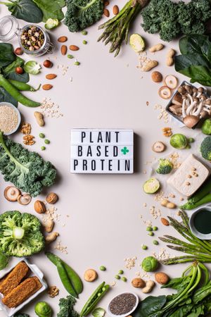 Healthy vegan, plant based protein source and body building food with “Vegan Based Protein” sign