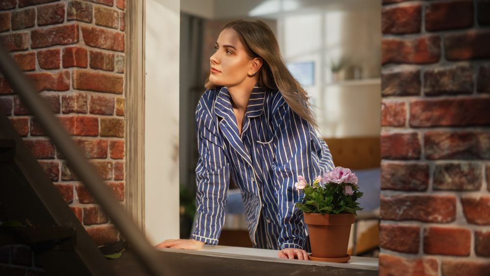 Young Female in Pyjamas Relaxing and Starting her Day with Wellbeing and Positivity