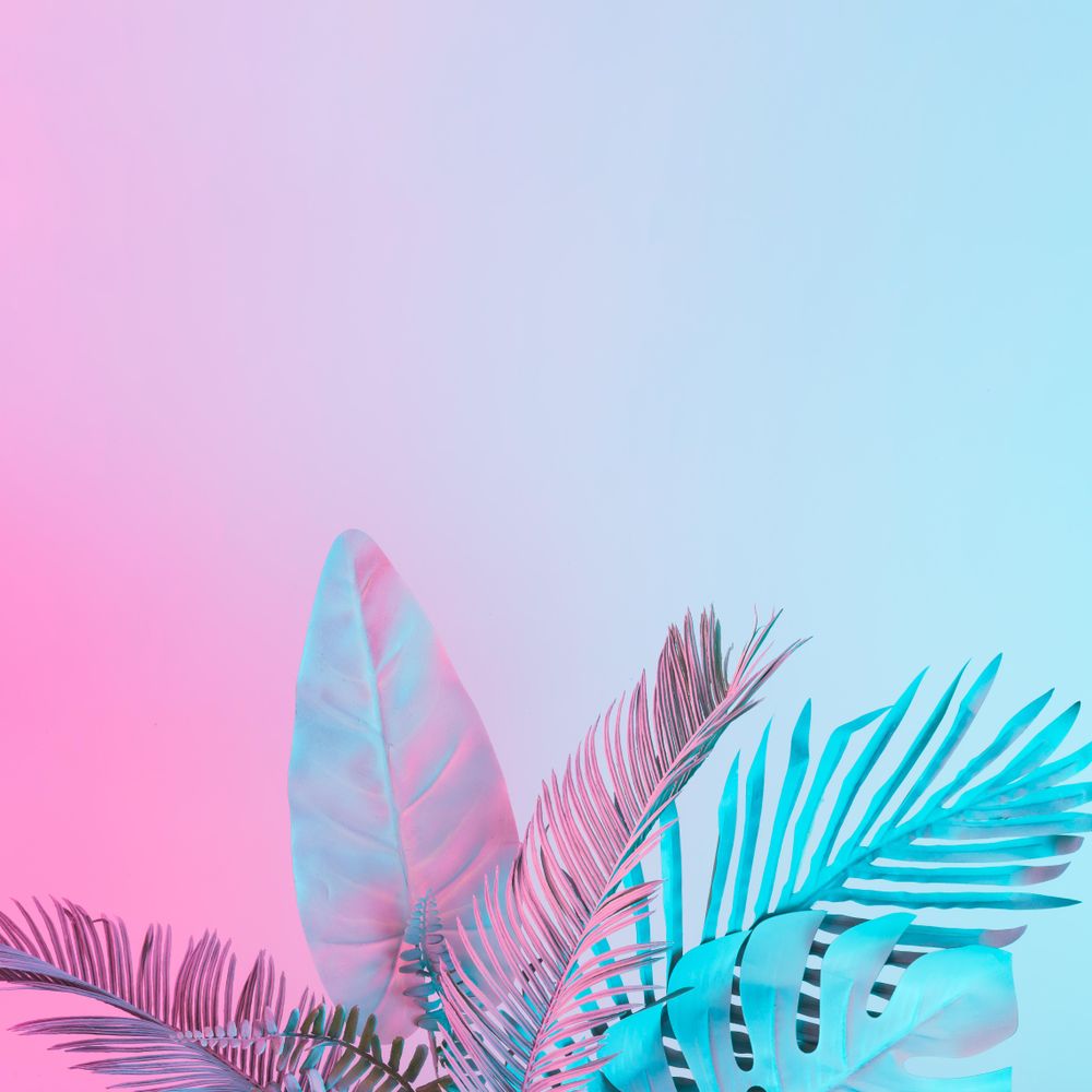 Tropical and palm leaves in vibrant bold gradient holographic colors