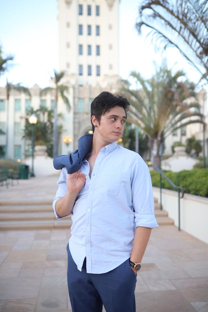 Man in blue suit looking away