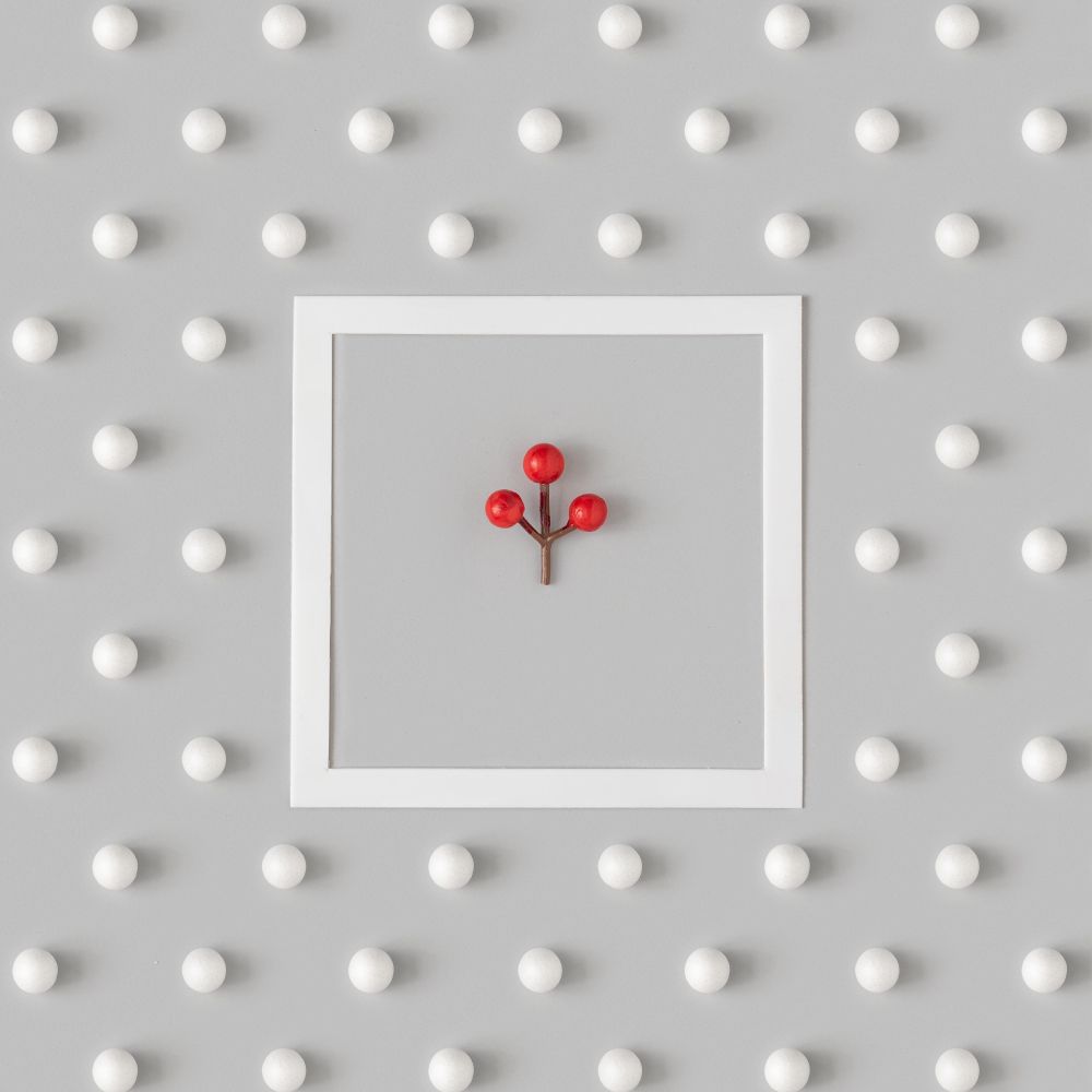 Holiday pattern with mistletoe berry and snowballs on gray background