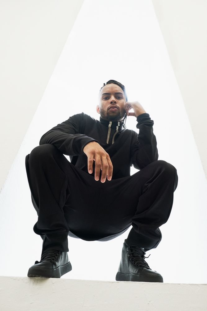 Dancing Black male with braids
