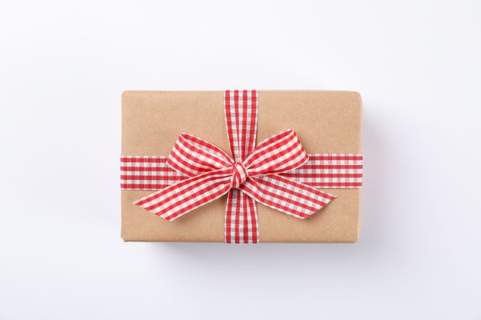 Beautiful gift box with bow on blank background, space for text
