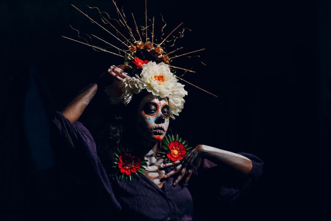 Woman with candy skull face paint and floral headdress
