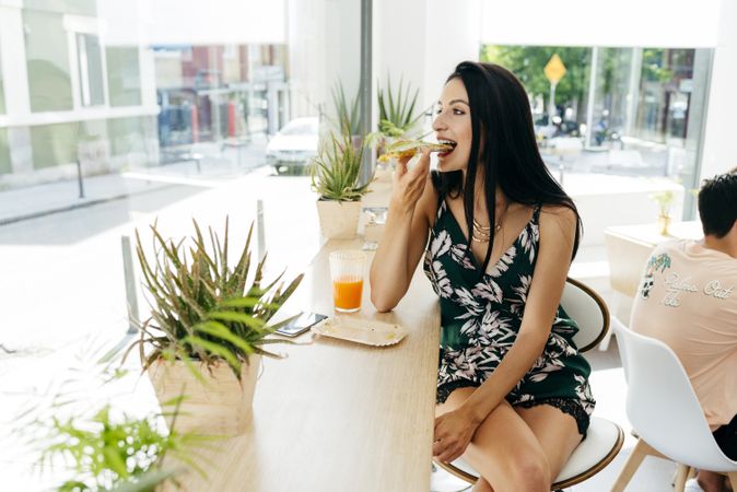 Woman eating healthy food in cafe