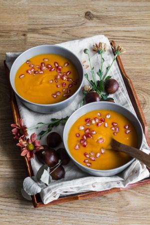 Served bowls of delicious pumpkin soup