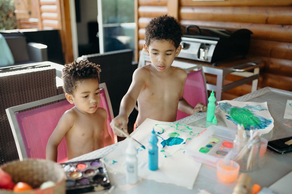 Black kids painting together