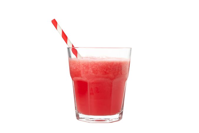 Glass of watermelon juice isolated on plain background. Fresh drink
