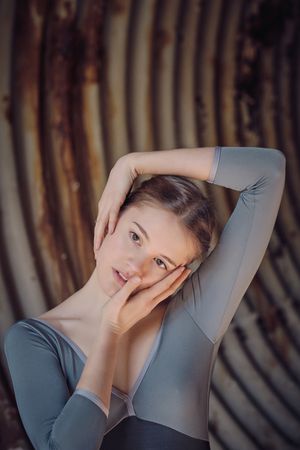 Woman dancing ballet in neglected tunnel