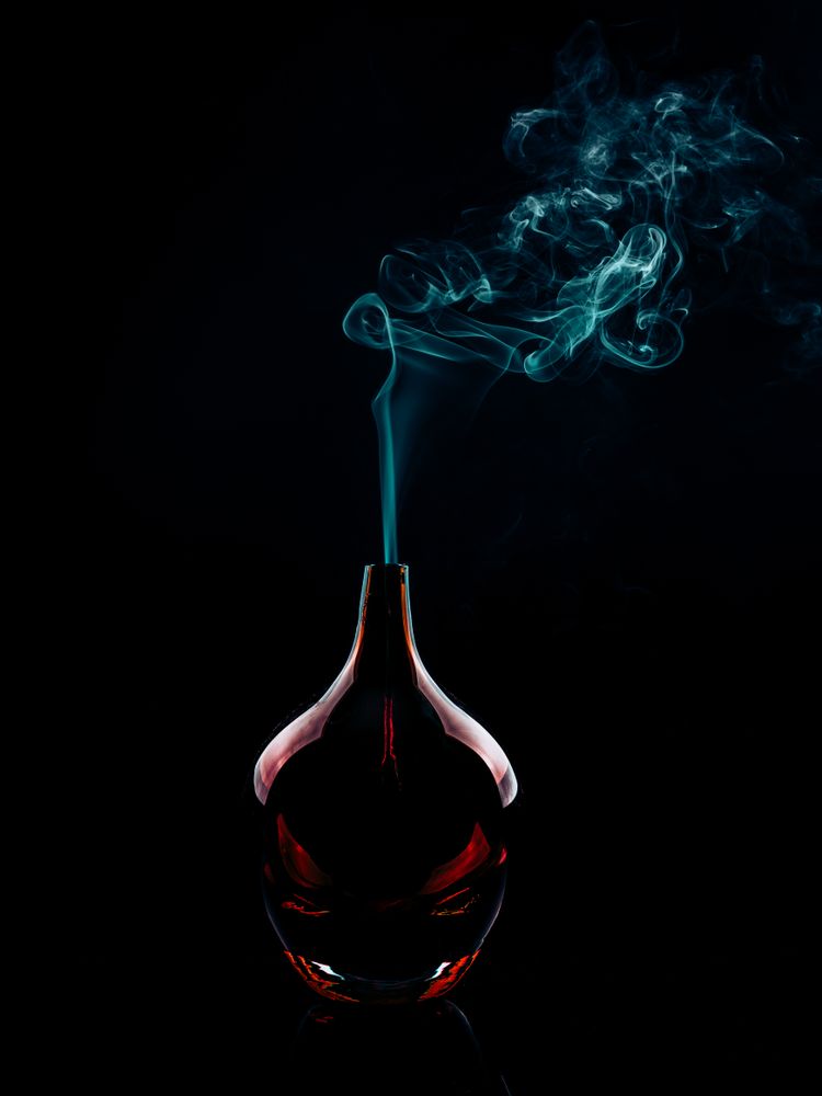 Glass bottle emitting smoke