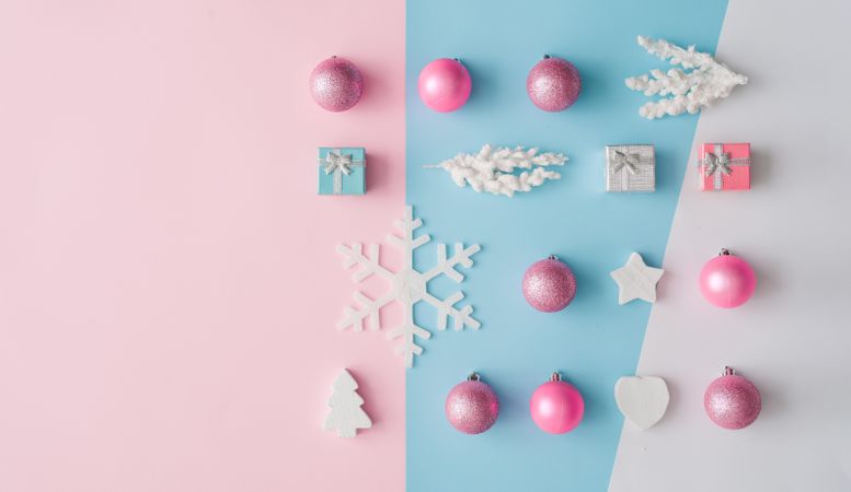 Christmas decorations on pastel pink and blue background