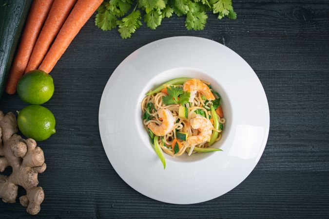 Tasty Pad Thai of vegetables and prawns in plate
