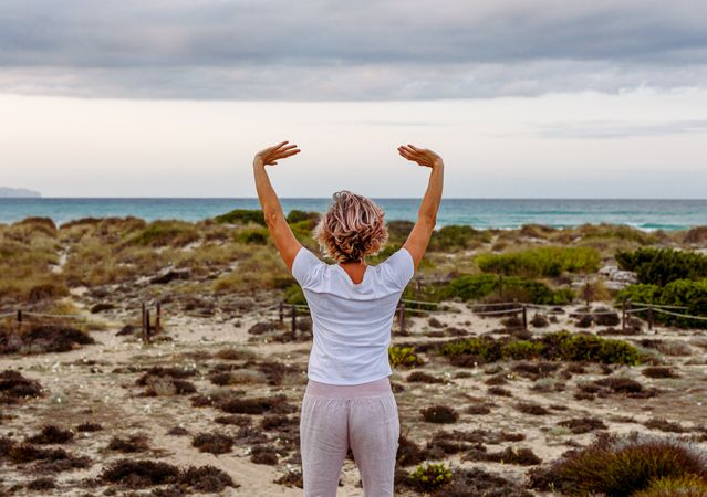 Adult woman practicing martial arts in nature