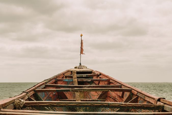 Old boat floating in sea