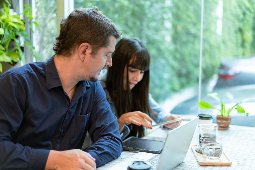 Man and woman having meeting at coffee shop