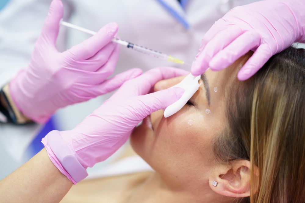 Woman having botox treatment on face