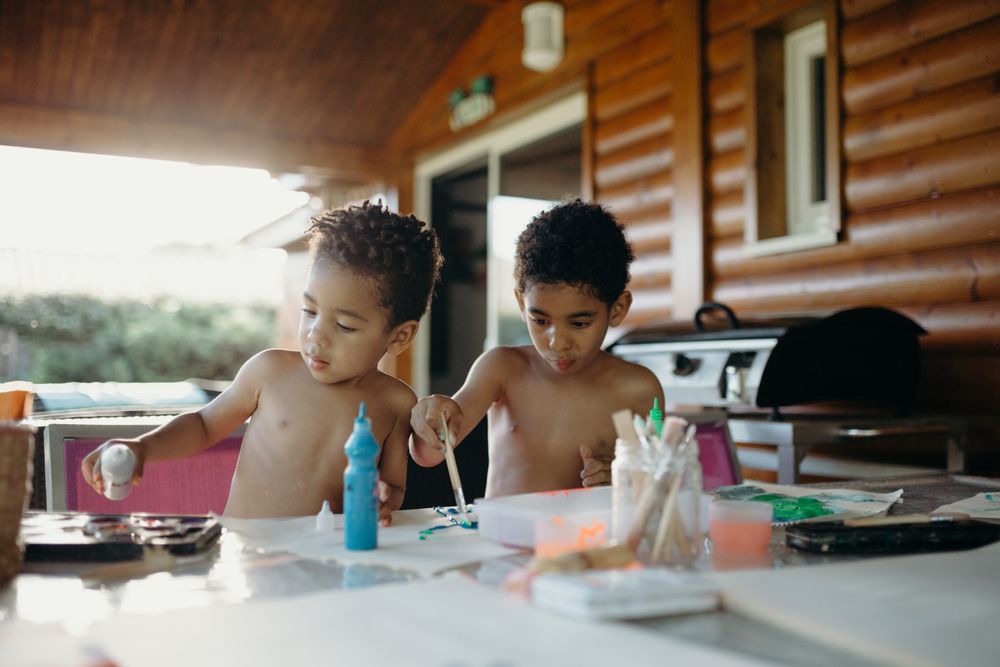 Black kids painting together