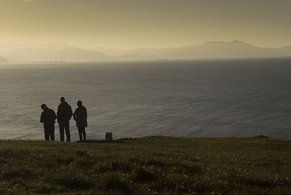 Tourists enjoying views at sea coast