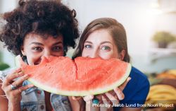 Female friends eating watermelon 4mMqd4