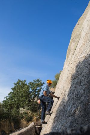 Free climber climbing in nature